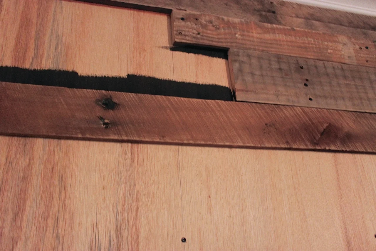 Painting the wall behind the pallets so the light background does not show through.
