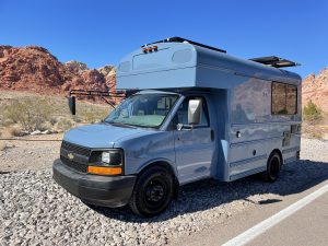 Custom rugged compact skoolie bus conversion at Red Rocks Canyon National Conservation Area