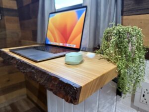 Office area in a beautiful custom built skoolie conversion | Juniper