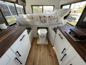 Custom skoolie conversion interior Nature's Head composting toilet
